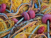 Carpet tile-maker helps turn fish nets into carpet yarn